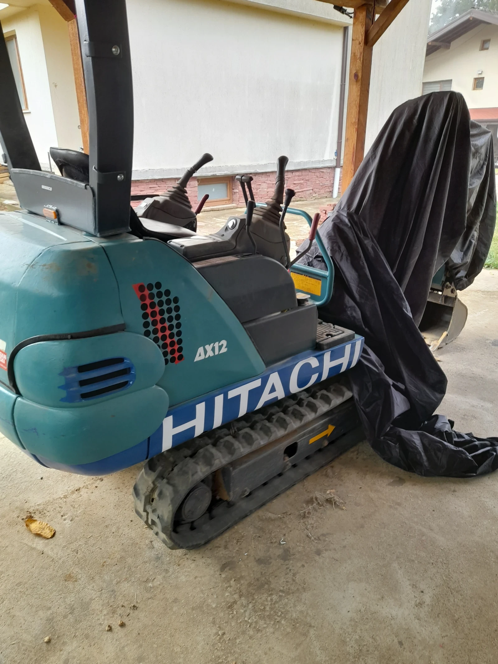 Багер Hitachi Airman
