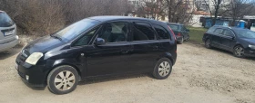     Opel Meriva 1.6  .