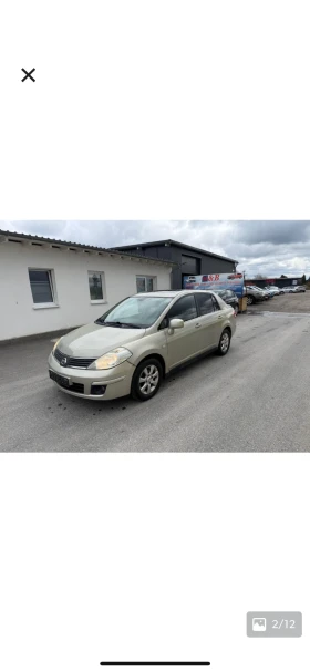 ������ Nissan Tiida