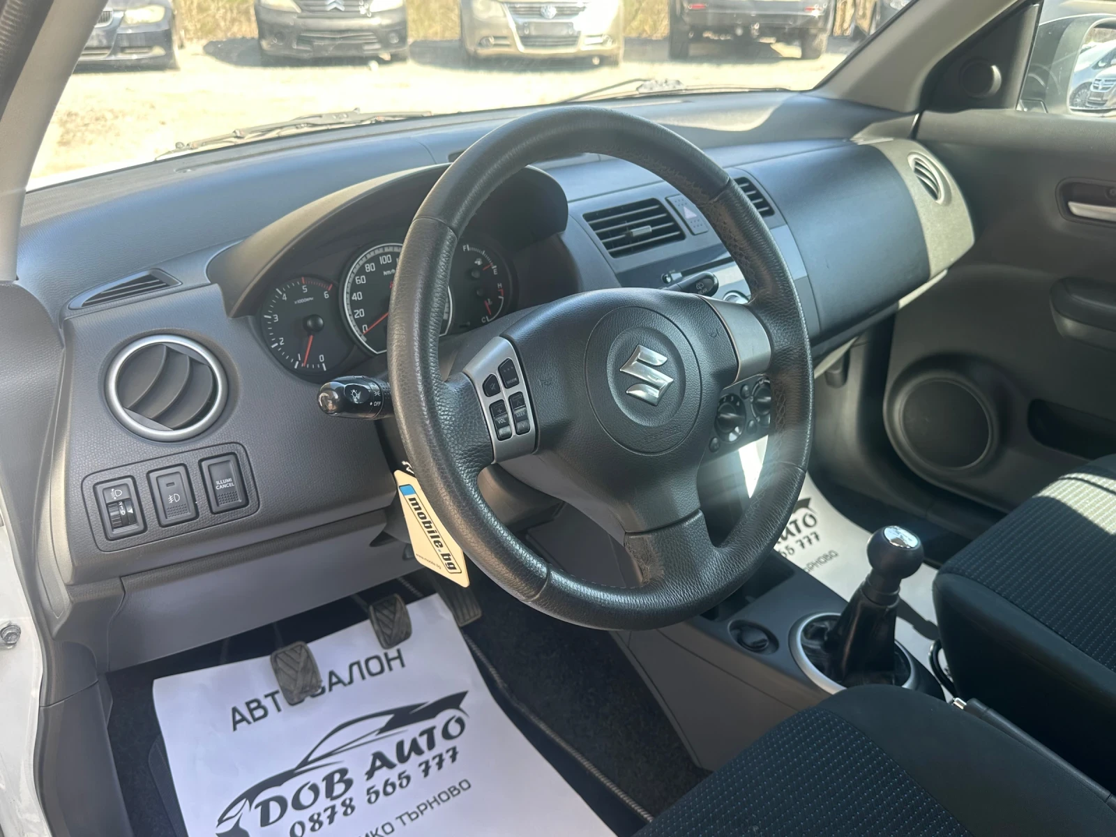 Suzuki Swift 1.3DDIS-75к.с-БЯЛА ПЕРЛА, снимка 9 - Автомобили и джипове - 53835438