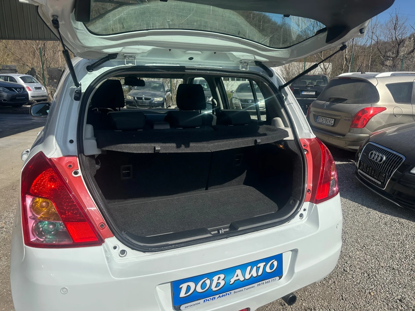 Suzuki Swift 1.3DDIS-75к.с-БЯЛА ПЕРЛА, снимка 14 - Автомобили и джипове - 53835438