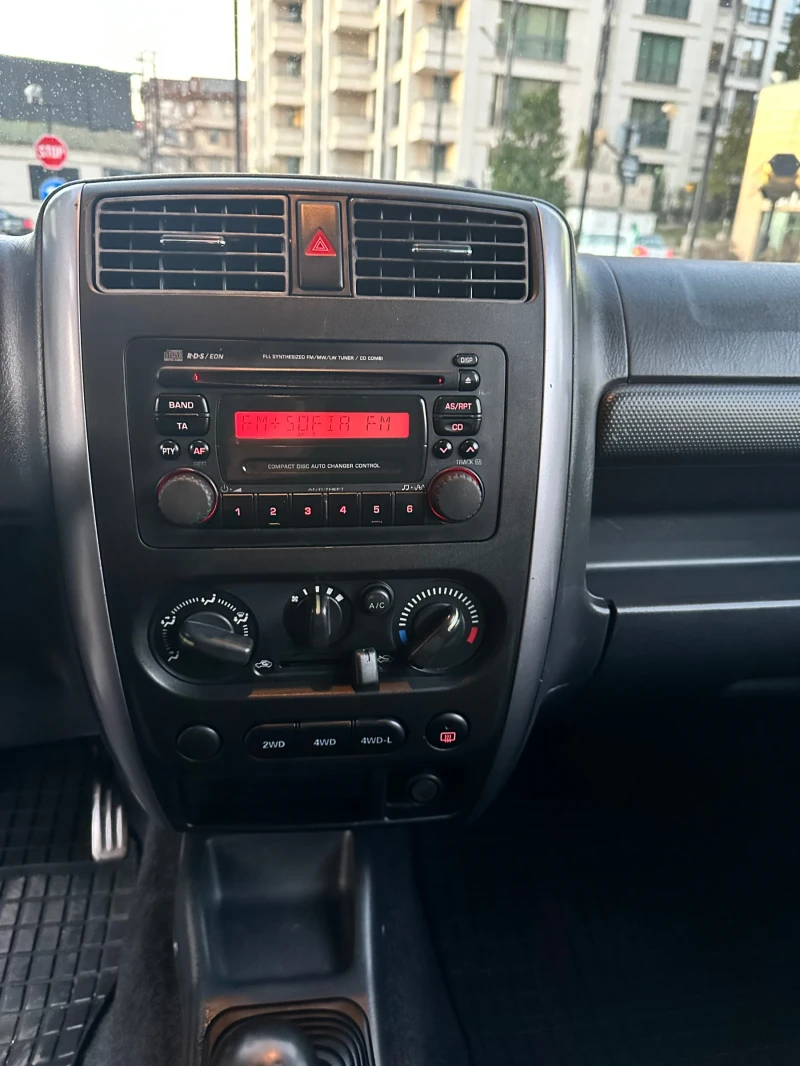 Suzuki Jimny 1.3 DOHC 4x4, снимка 8 - Автомобили и джипове - 50257570