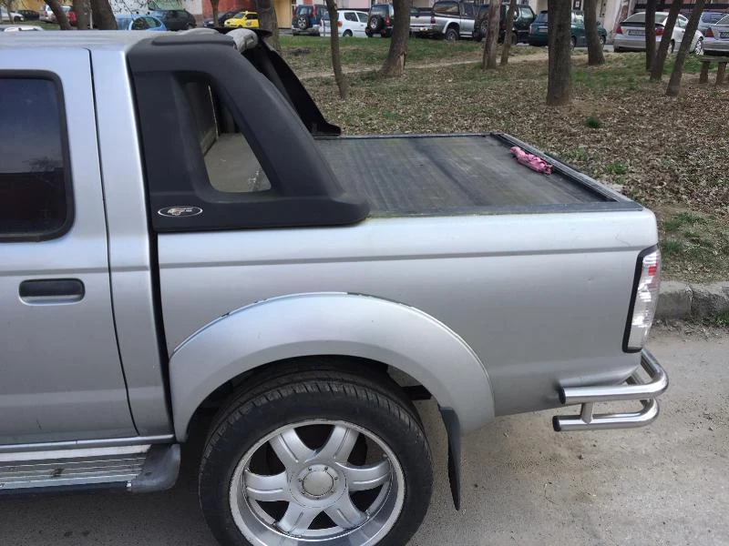 Nissan Navara 2.5td, снимка 7 - Автомобили и джипове - 21410834