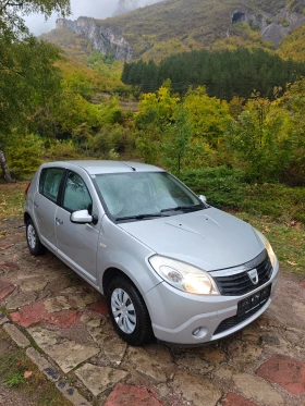 Обява за продажба на Dacia Sandero 1.4I КЛИМАТИК ~3 499 лв. - изображение 1