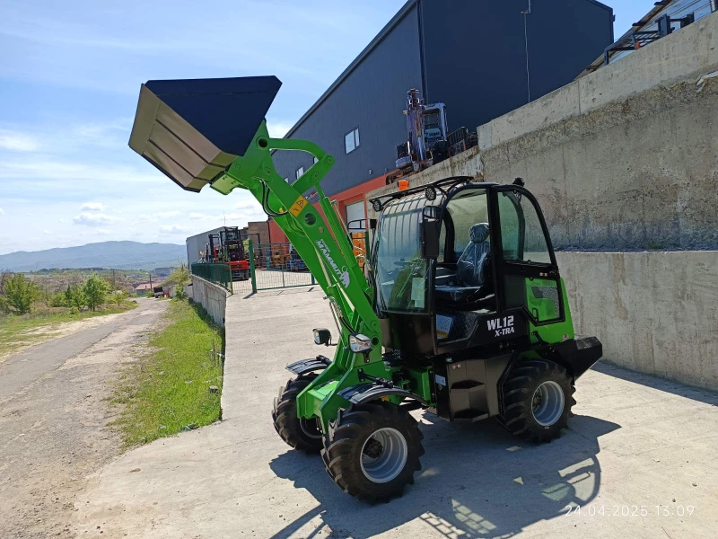 Телескопичен товарач Komatsu МАМУТ X -TRA